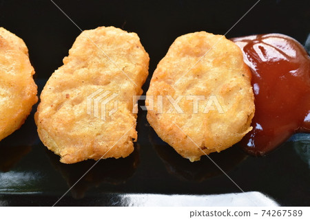 fried chiken nugget meat dipping ketchup on plate 74267589