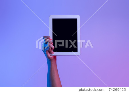 Male African American Hand Holding Digital Tablet With Black Screen, Neon Lighting Male African American Hand Holding Digital Tablet With Black Screen, Neon Lighting 74269423