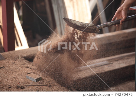 Carpenter, he is working in the workshop. Man at work on wood. Image of mature carpenter in the workshop, furniture making concept. 74270475