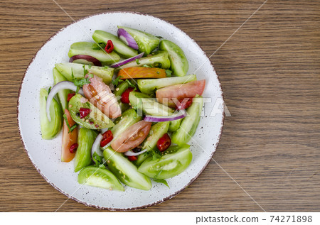 Spicy appetizer of canned pickled red and green tomatoes 74271898