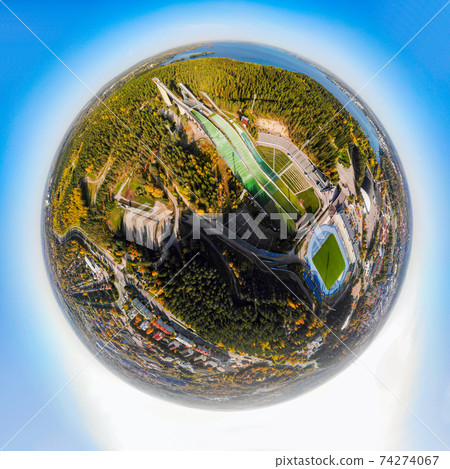 A three dimensional aerial panoramic view of Lahti sports centre with three ski jump towers A three dimensional aerial panoramic view of Lahti sports centre with three ski jump towers 74274067