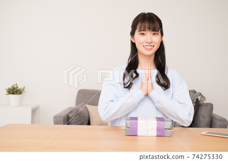 A woman who has a meal before eating a lunch box A woman who has a meal before eating a lunch box 74275330