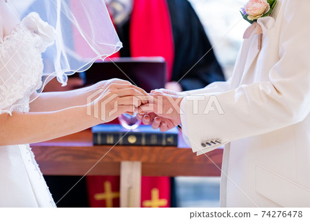 Chapel bride and groom ring exchange Chapel bride and groom ring exchange 74276478