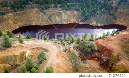 Toxic red lake in Mitsero, Cyprus in open pit of abandoned Kokkinopezoula copper mine Toxic red lake in Mitsero, Cyprus in open pit of abandoned Kokkinopezoula copper mine 74276511