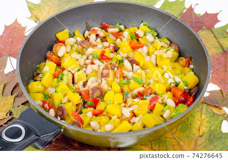 Frying pan with vegetable stew with pumpkin and white beans 74276645