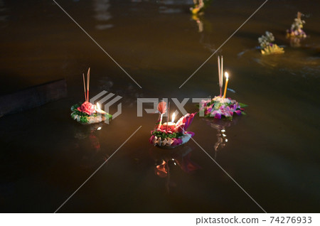 Loy Krathong festival, People buy flowers and candle to light and float on water to celebrate the Loy Krathong festival in Thailand 74276933