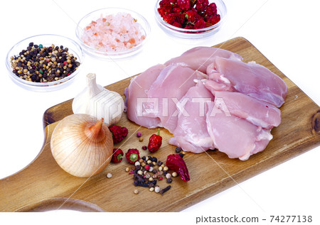 Fresh raw pink eco chicken fillet for cooking on white plate. Studio Photo 74277138