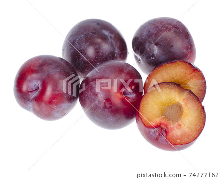 Ripe round sweet plum on white background 74277162
