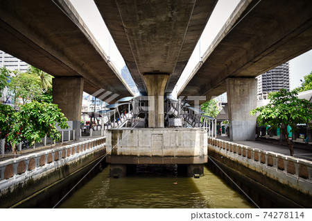 Beneath the Taksin Bridge, view of the Sathorn Pier on the Chao Phraya River Beneath the Taksin Bridge, view of the Sathorn Pier on the Chao Phraya River 74278114
