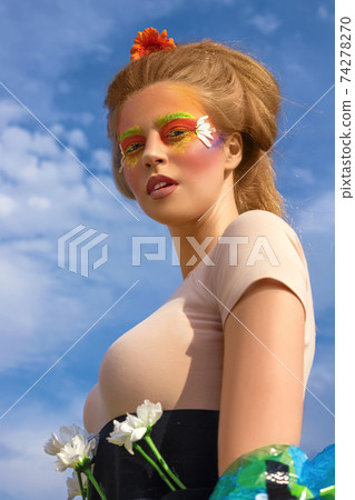 Creative fashionable beauty portrait of a beautiful young woman with long hair 74278270