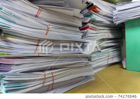 Close up stack of document at office Close up stack of document at office 74278846