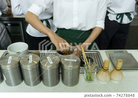 barista making Japanese green tea in the cafe barista making Japanese green tea in the cafe 74278848