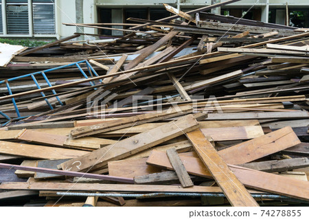 Pile of waste wood from the demolition construction sites Pile of waste wood from the demolition construction sites 74278855