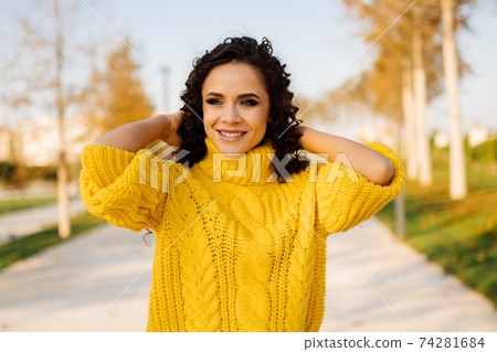 Bright in a yellow sweater amazingly beautiful. Stock Photo 74281684 PIXTA