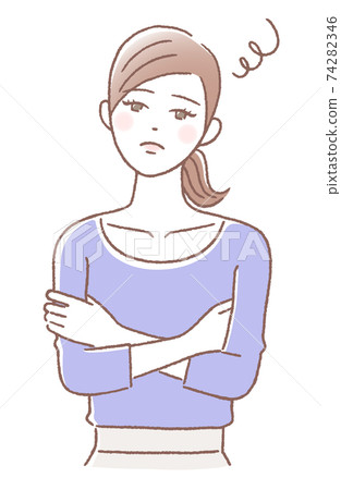 A woman with a troubled face with her arms folded A woman with a troubled face with her arms folded 74282346
