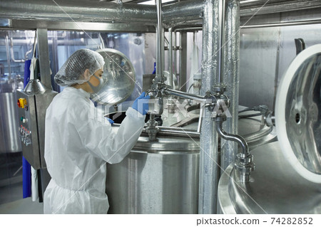 Female Worker Controlling Production 74282852