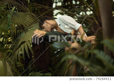 Romantic Couple in Love Standing in the Tropical Jungle Romantic Couple in Love Standing in the Tropical Jungle 74284411