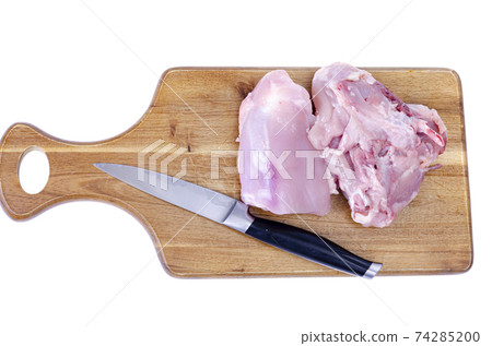 Raw meat. Two pieces of chicken thighs for cooking. Studio Photo Raw meat. Two pieces of chicken thighs for cooking. Studio Photo 74285200