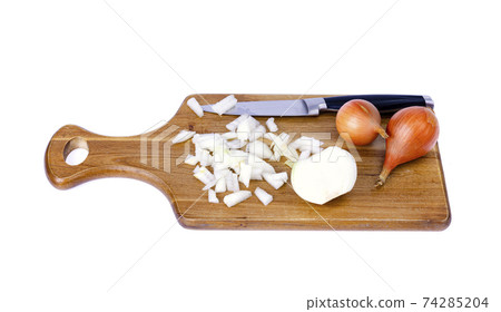 Slices of chopped onion on kitchen cutting board. Studio Photo 74285204