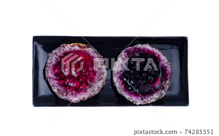 Sand baskets with sweet berries and jelly on white background. Studio Photo 74285351