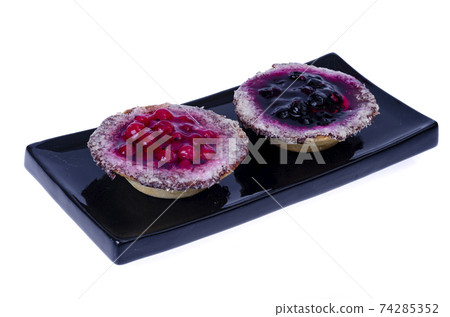Sand baskets with sweet berries and jelly on white background. Studio Photo 74285352