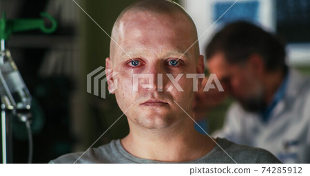 Bald man with cancer crying in hospital Bald man with cancer crying in hospital 74285912
