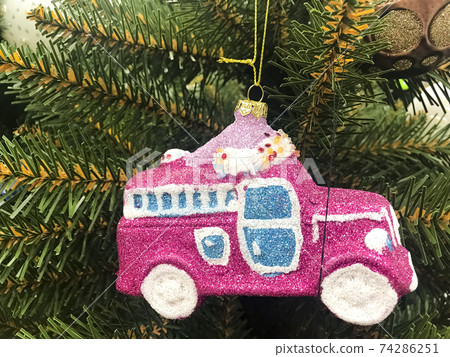 Sale of Christmas souvenirs, Christmas tree decorations in the store 74286251