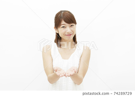 Female hand out white background 74289729