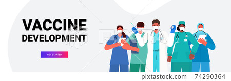 doctors team in medical masks holding syringe and bottle vial coronavirus vaccine development medical immunization 74290364