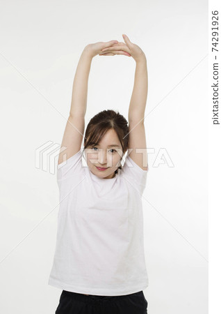 Women doing gymnastics to maintain their health Women doing gymnastics to maintain their health 74291926