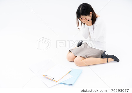 An office woman sitting on the floor and crying due to overwork An office woman sitting on the floor and crying due to overwork 74293077