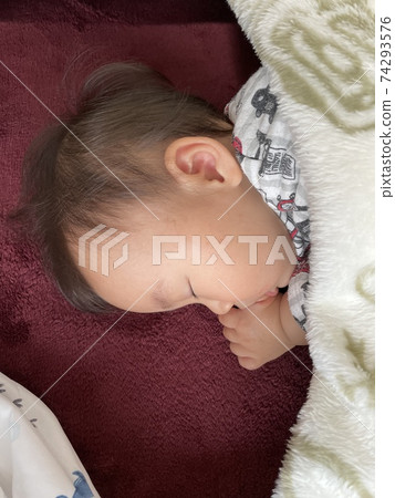 Baby boy sleeping soundly 74293576