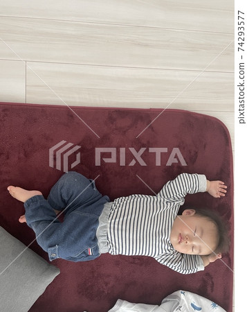 Baby boy sleeping soundly 74293577