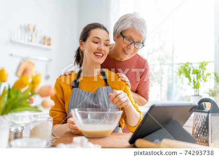 family are preparing bakery together 74293738
