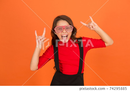 Rock party. Masquerade concept. Kid and striped eyeglasses. 74295885