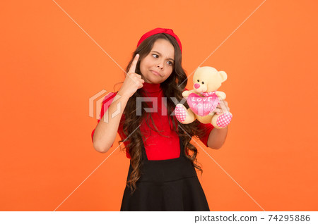 Imaginative play. Strict girl play with teddy bear. Childhood  74295886