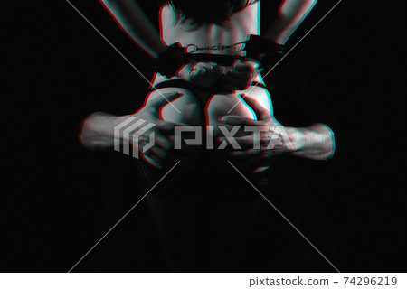 male dominants touch the sexy ass of a submissive girl in handcuffs 74296219