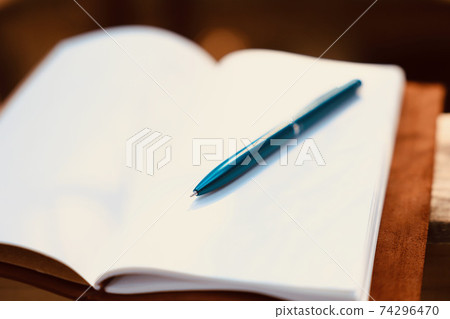 Pocketbook and ballpoint pen 74296470