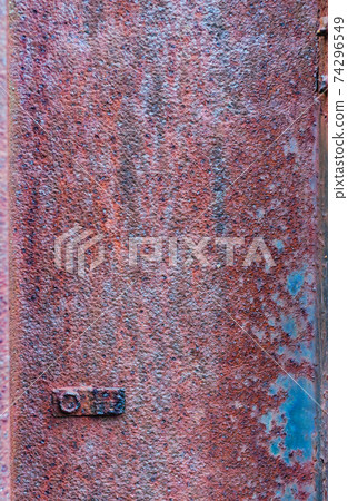 Rusty metal surface, not painted, oxidized rough texture, brown rust with peeling blue paint, outdoors Rusty metal surface, not painted, oxidized rough texture, brown rust with peeling blue paint, outdoors 74296549