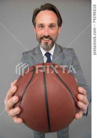 Play basketball be happy. Happy businessman hold basket 74296818
