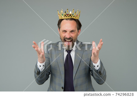 Emotional king man wearing golden crown, feel power concept Emotional king man wearing golden crown, feel power concept 74296828