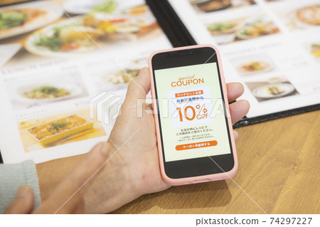 Woman in restaurant 74297227