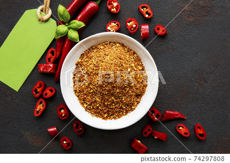 Red chili pepper, dried chillies on dark background. Top view Red chili pepper, dried chillies on dark background. Top view 74297808