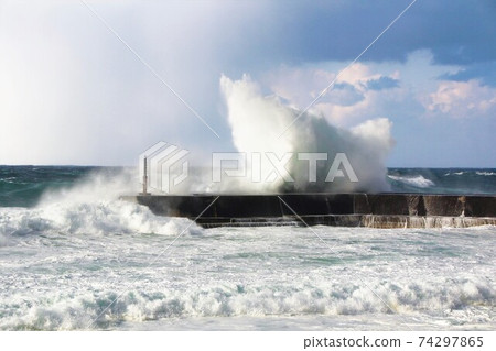 Breakwater hit by rough waves in the Sea of Japan in winter Breakwater hit by rough waves in the Sea of Japan in winter 74297865