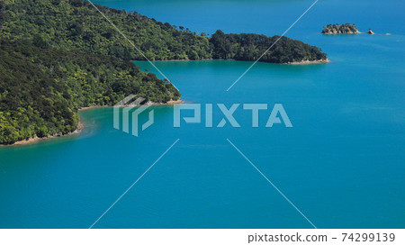 Turquoise water of a fjord in the Marlborough Sounds. Turquoise water of a fjord in the Marlborough Sounds. 74299139