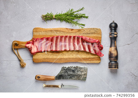 Overhead view of raw fresh deer ribs with spice and herb Overhead view of raw fresh deer ribs with spice and herb 74299356
