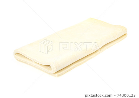 Folded plate raw dough on white background. Folded plate raw dough on white background. 74300122