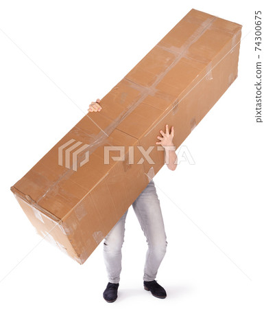 Man carrying a oversized cardboard box Man carrying a oversized cardboard box 74300675