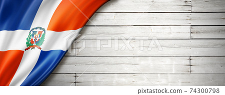 Dominican Republic flag on old white wall banner 74300798