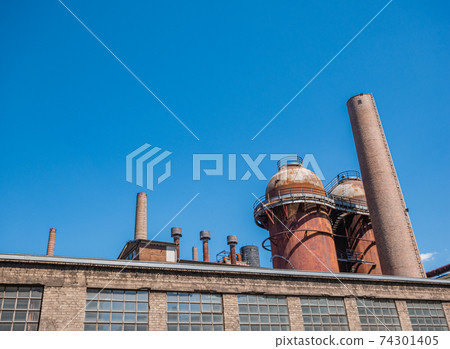Very old brick industrial plant with steel tanks Very old brick industrial plant with steel tanks 74301405